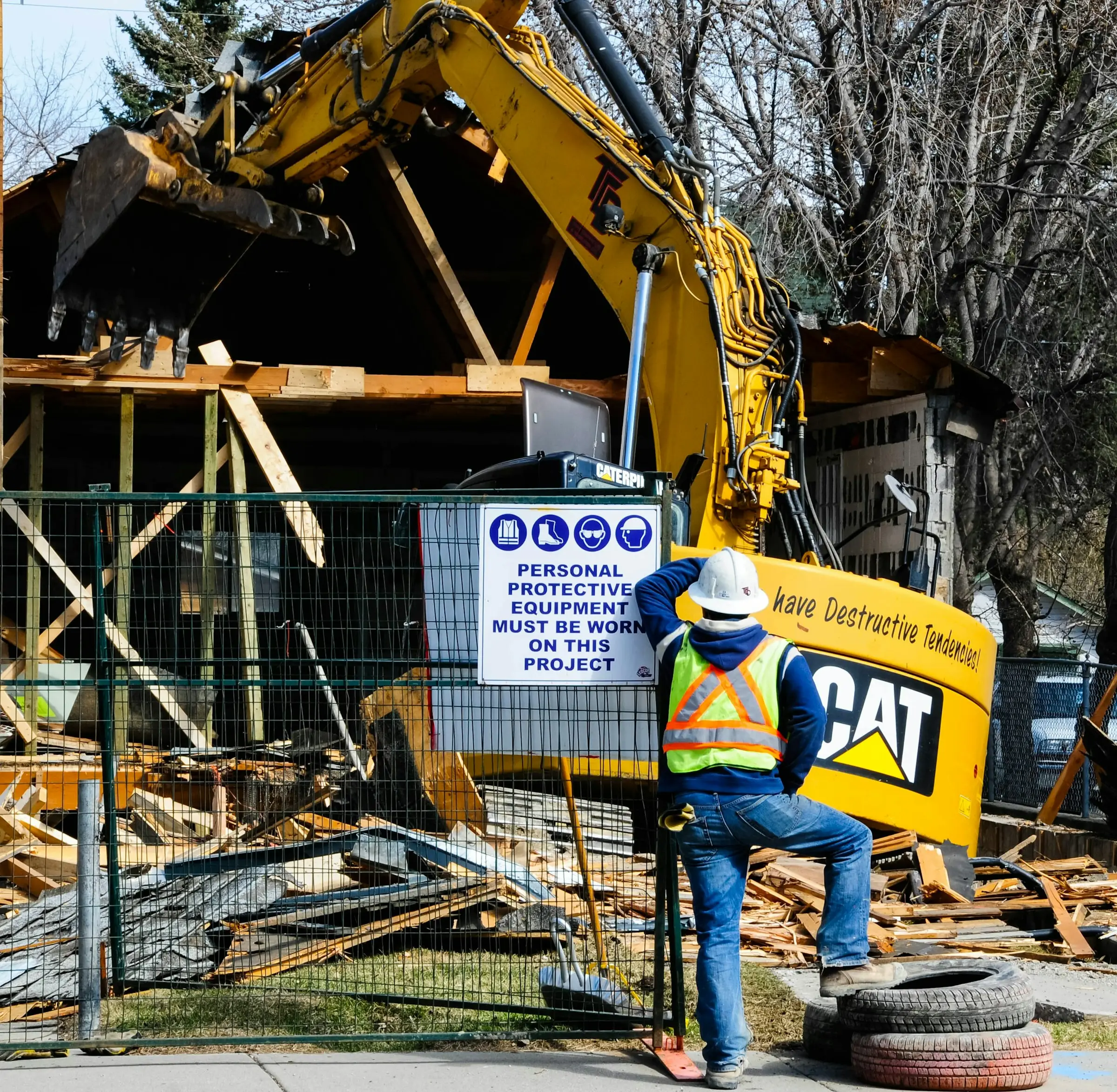 Structure being demolished with debris on the ground